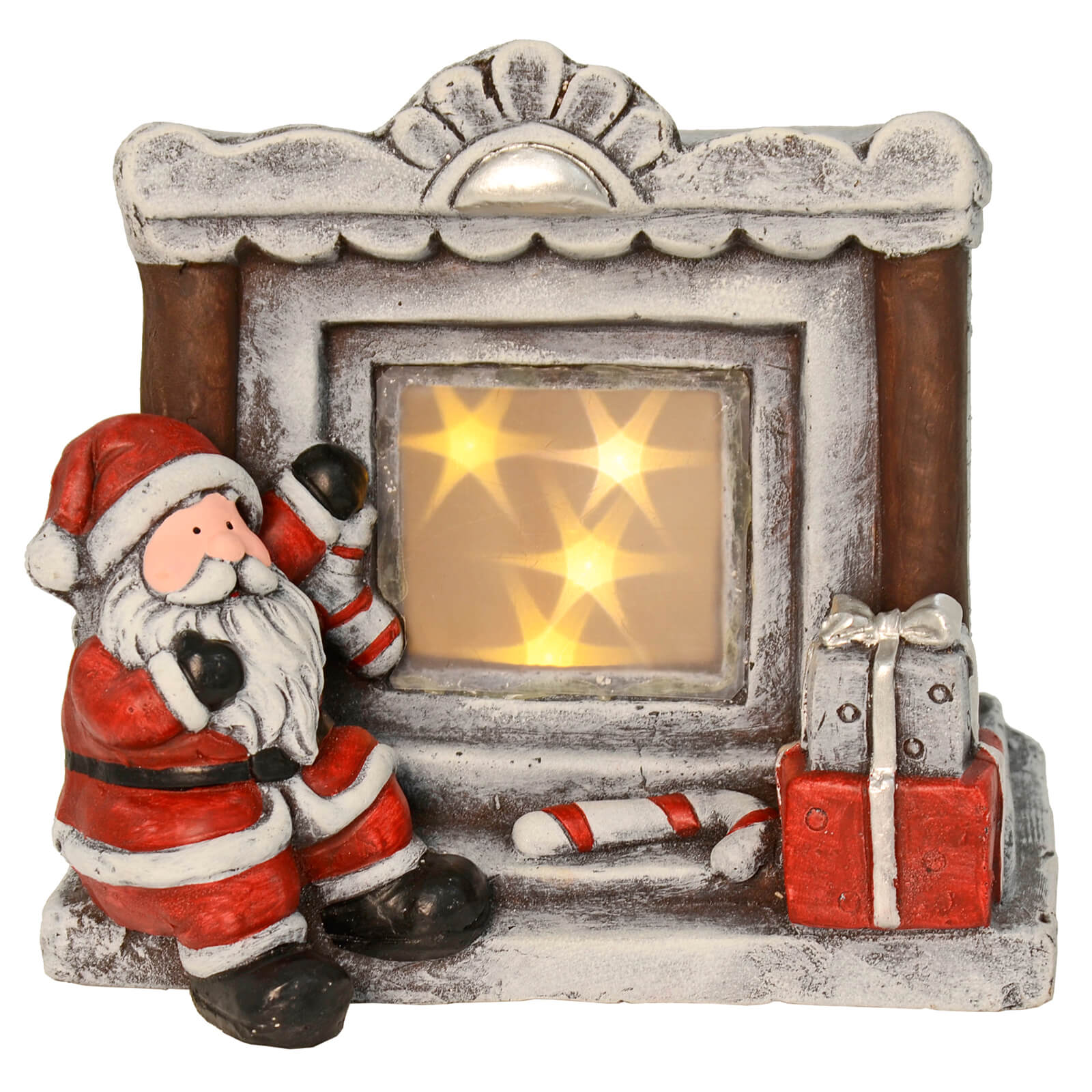 Santa Claus stitting at a fireplace Christmas ornament with light up stars, retro mantelpiece, stock, candy cane and Christmas presents